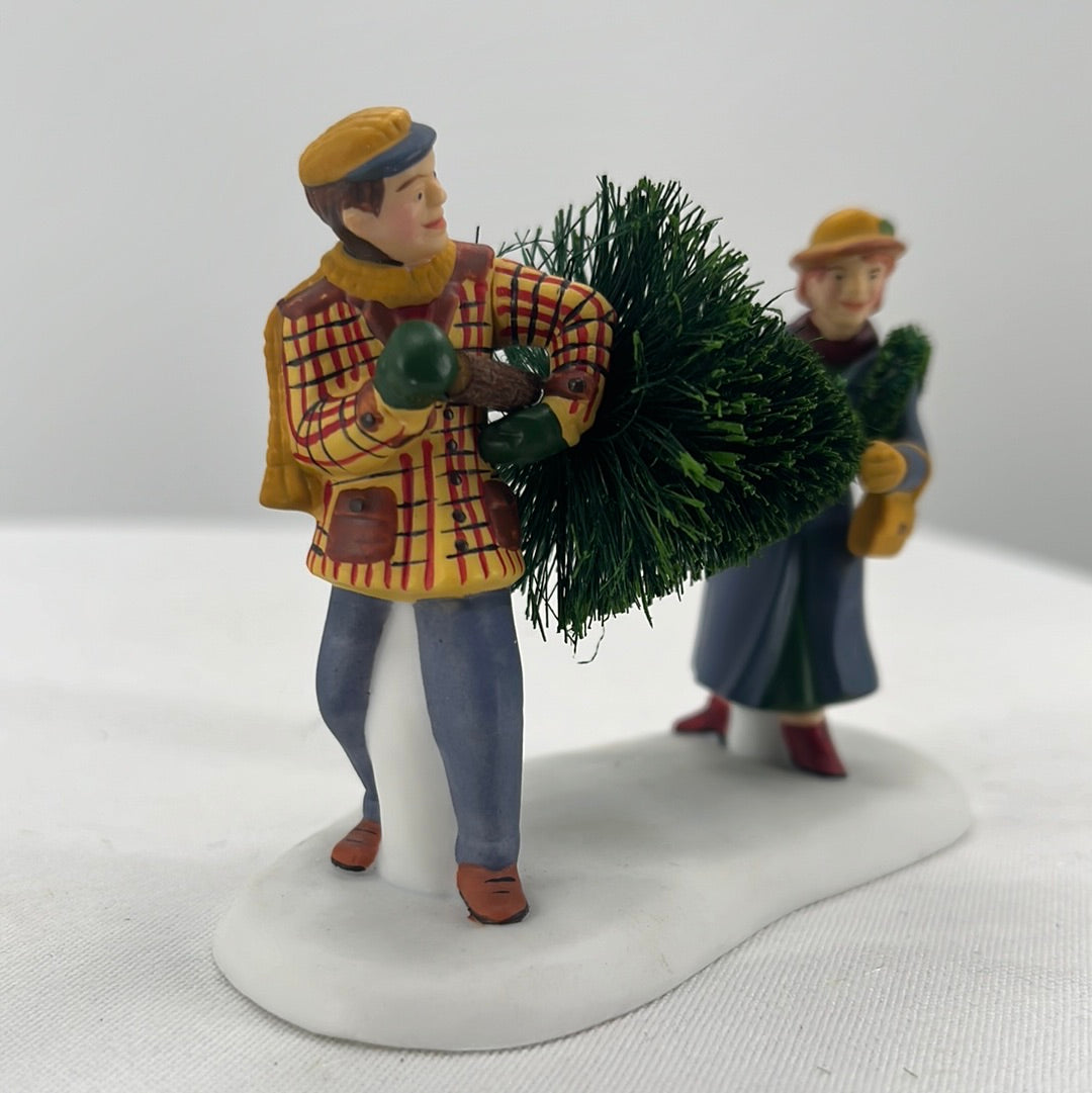 Department 56 Christmas in the City Picking Out the Christmas Tree (set of 3) figurine, side view.