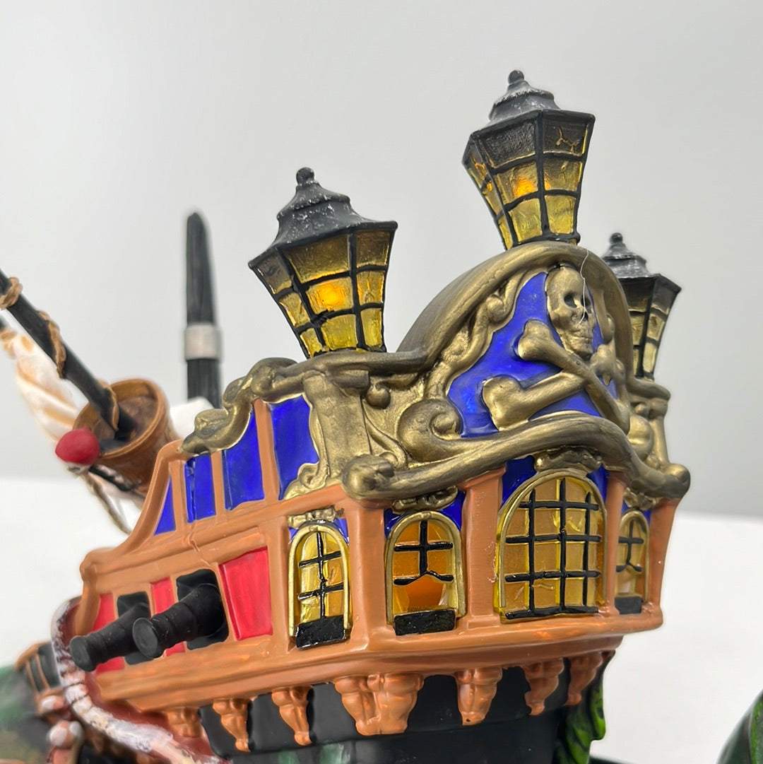 Department 56 Snow Village Halloween Ship of Sea Phantoms, side view lit. 