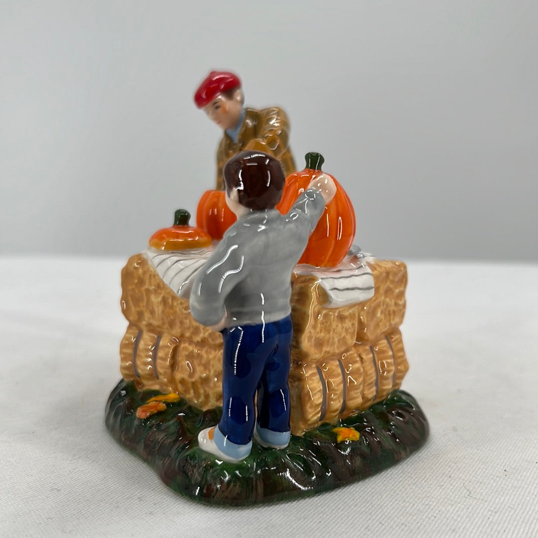 Department 56 Snow Village Halloween Gross… Pumpkin Guts ceramic accessory, side view close-up.