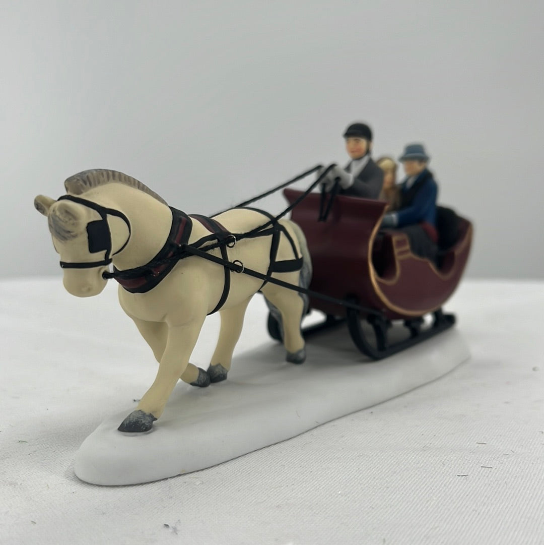 Department 56 Christmas in the City Sleigh Ride, front view.