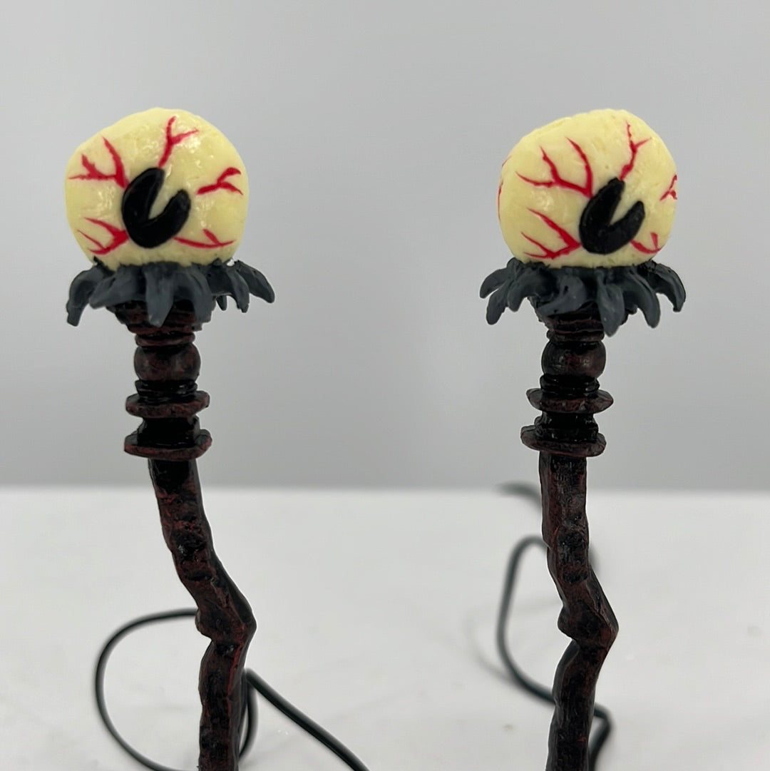 Department 56 Snow Village Halloween Eyeball Street Lights (Set of 2), front view close-up.