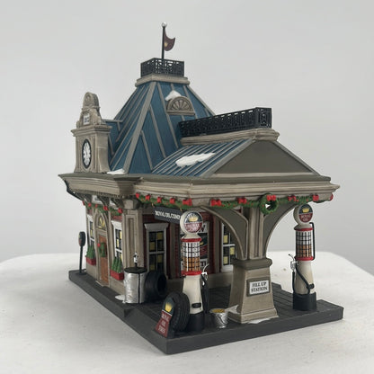 Department 56 Christmas in the City Royal Oil Company (Set of 2) lighted building, side view.