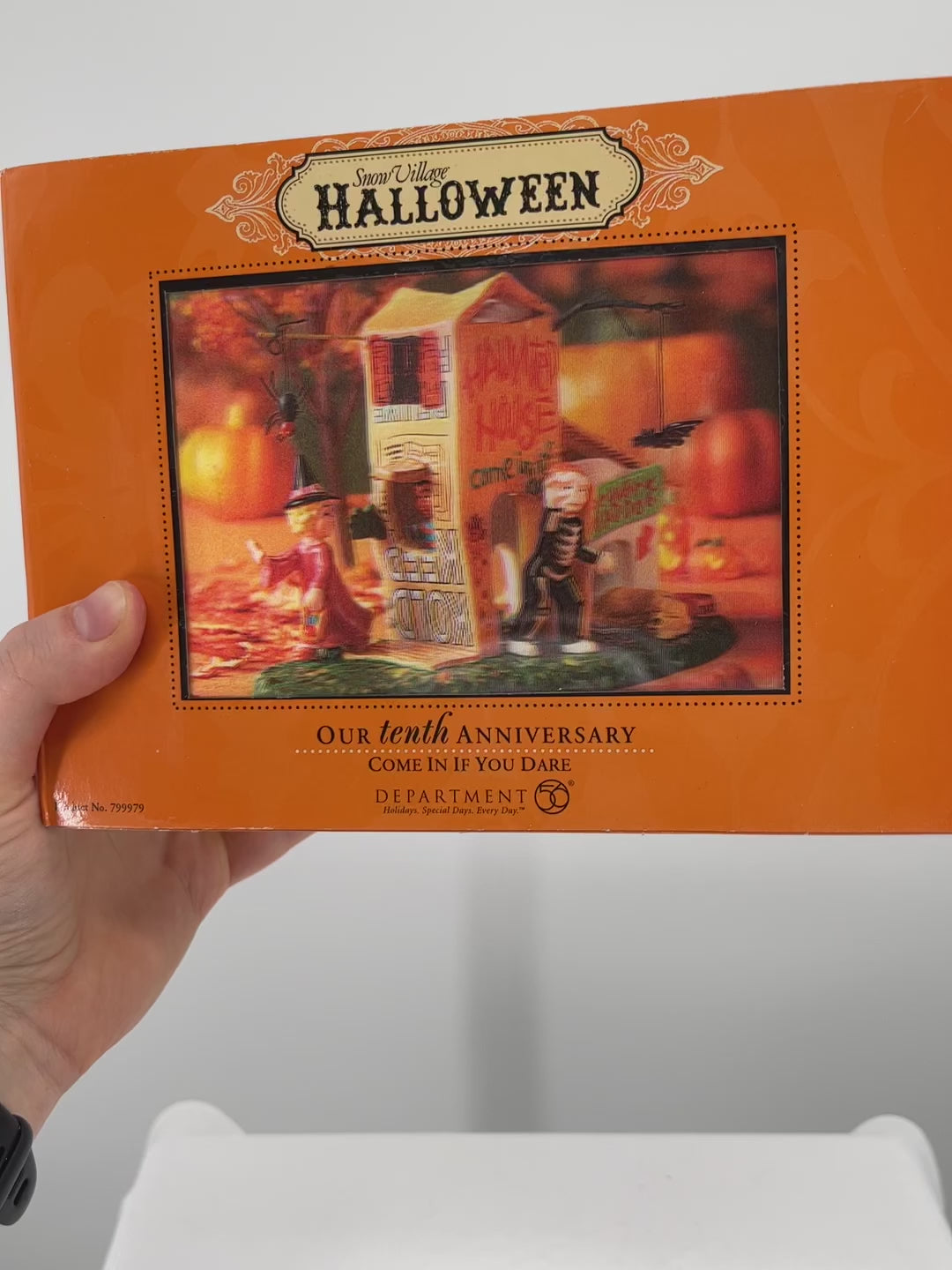 Department 56 Snow Village Halloween Come in if You Dare packaging moving image, front view.